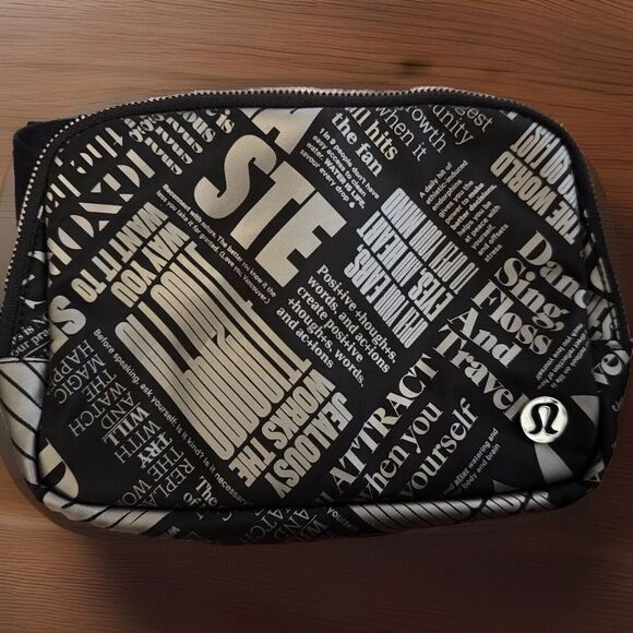lululemon athletica Handbags - Lululemon‎ Everywhere Belt Bag Manifesto Print Black/Silver 1L Excellent